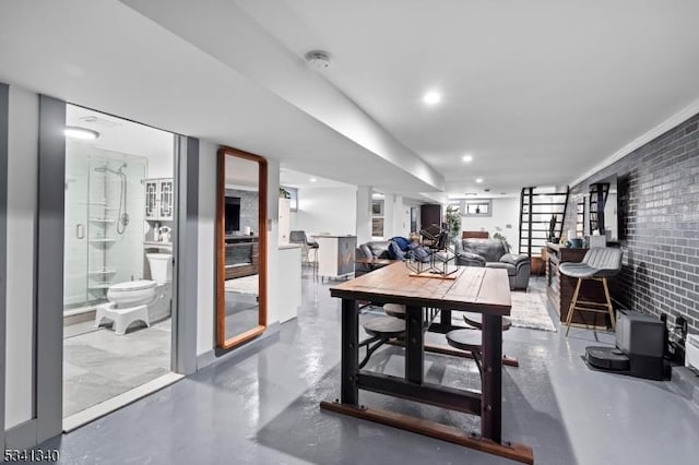 dining space featuring concrete flooring and recessed lighting