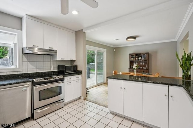 4 Dorrien Rd, Livingston Twp, NJ 07039 - kitchen with stainless steel appliances, under cabinet range hood, white cabinetry, ornamental molding, and backsplash