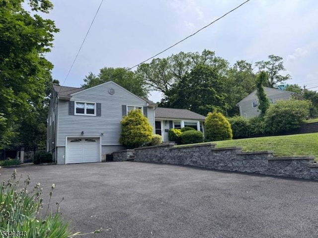 4 Dorrien Rd, Livingston Twp, NJ 07039 - view of side of home with driveway and an attached garage