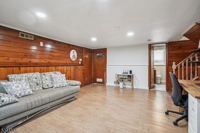 4 Dorrien Rd, Livingston Twp, NJ 07039 - living room with a desk, wooden walls, light wood-type flooring, stairway, and recessed lighting