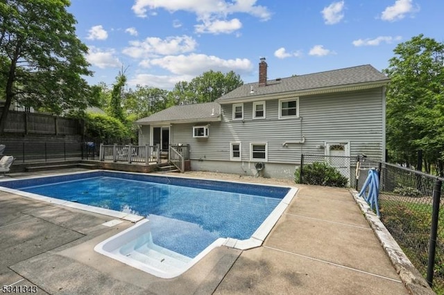 4 Dorrien Rd, Livingston Twp, NJ 07039 - view of pool with a wooden deck and a fenced backyard
