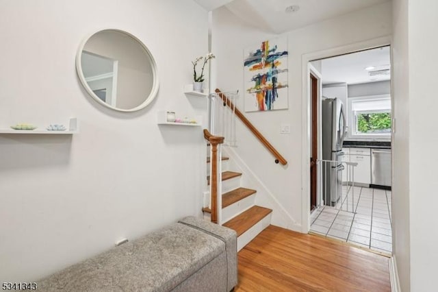 4 Dorrien Rd, Livingston Twp, NJ 07039 - staircase featuring wood finished floors