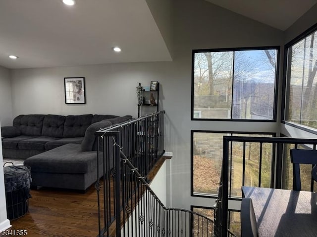 living room with lofted ceiling, wood finished floors, and recessed lighting