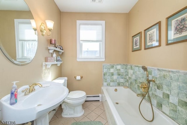 full bath with a garden tub, tile patterned flooring, toilet, a baseboard heating unit, and a sink