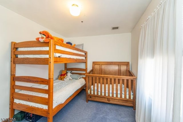 bedroom featuring carpet flooring and visible vents