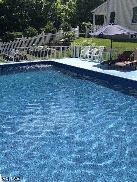 view of pool with fence, a fenced in pool, and a patio