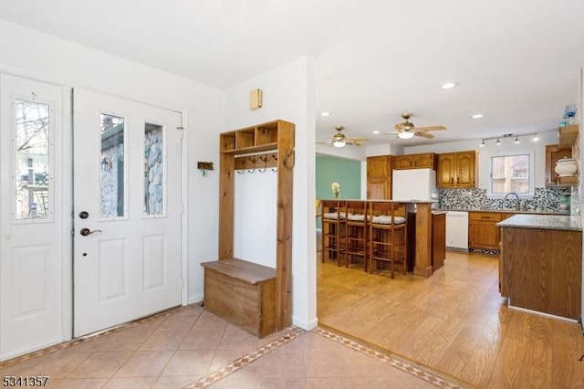 entryway featuring light tile patterned flooring and recessed lighting