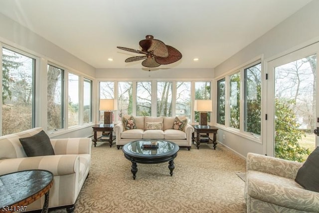 sunroom / solarium featuring ceiling fan and a wealth of natural light