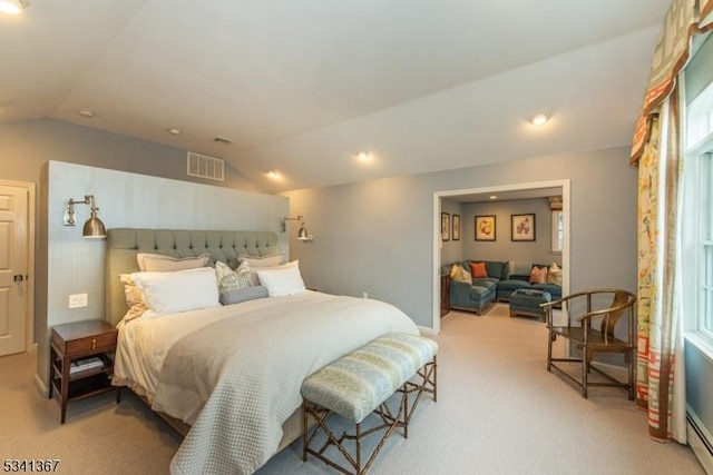 bedroom with vaulted ceiling, carpet floors, a baseboard radiator, and visible vents