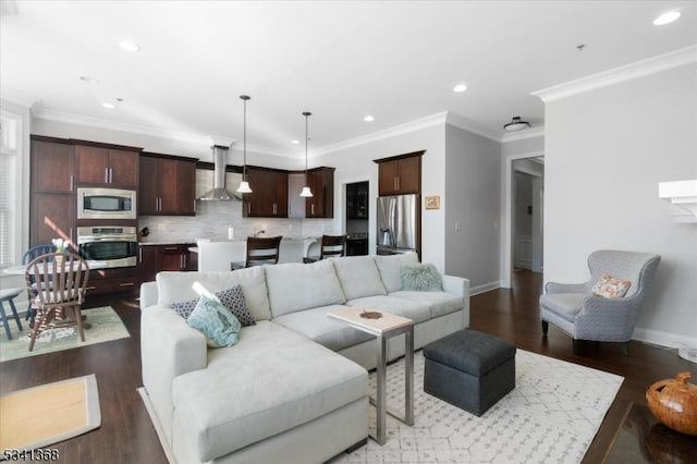 living area with crown molding, recessed lighting, wood finished floors, and baseboards