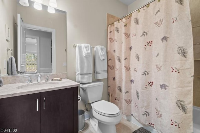 bathroom featuring toilet and vanity