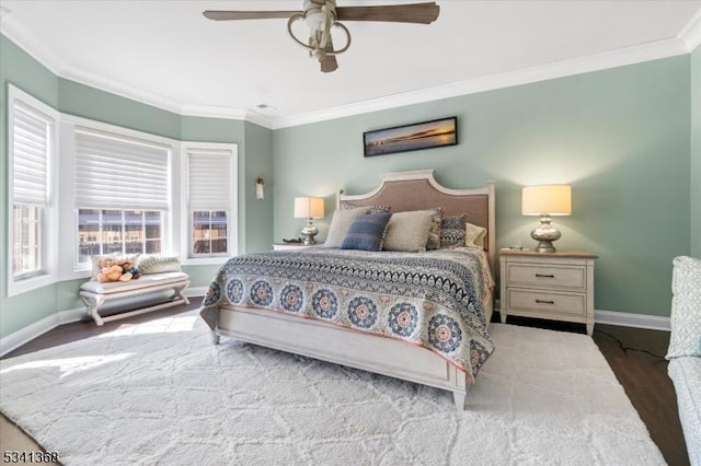 bedroom featuring baseboards, ceiling fan, wood finished floors, and crown molding