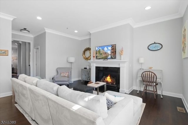 living area with dark wood-type flooring, ornamental molding, and baseboards