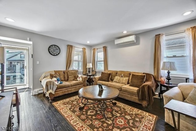 living area featuring a baseboard radiator, dark wood finished floors, an AC wall unit, and recessed lighting