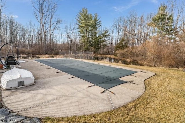 view of pool with a patio area and a covered pool