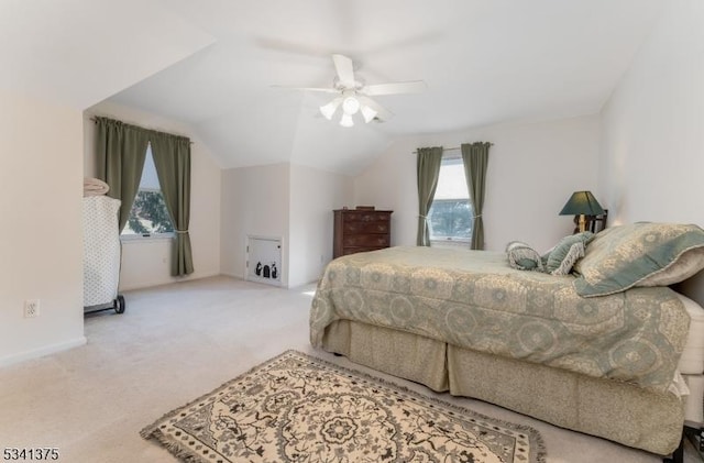 bedroom with vaulted ceiling, ceiling fan, carpet flooring, and baseboards