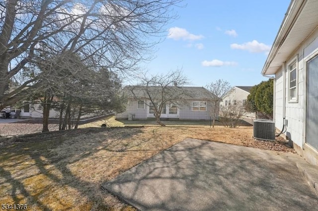 view of yard with a patio area and central AC unit