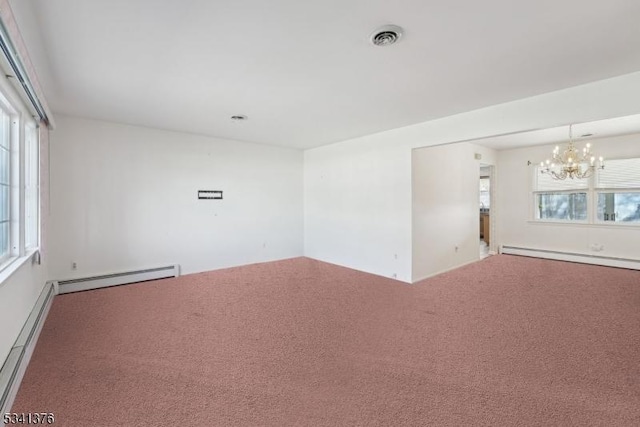 carpeted empty room with a baseboard heating unit, a notable chandelier, visible vents, and a baseboard radiator