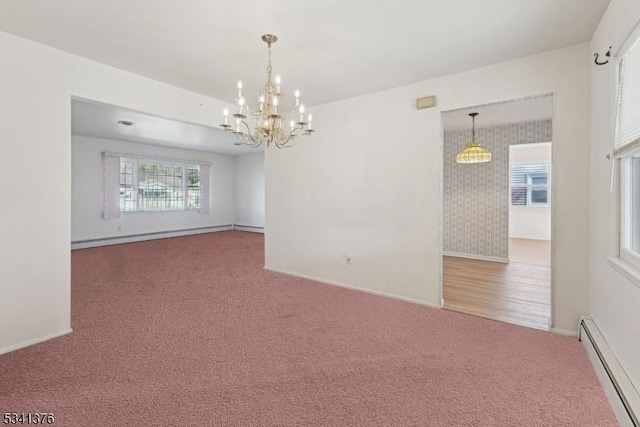 carpeted empty room featuring a baseboard heating unit, a notable chandelier, baseboards, and a baseboard radiator