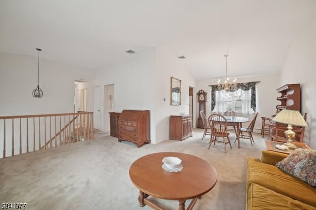 carpeted living room featuring vaulted ceiling, visible vents, and a notable chandelier