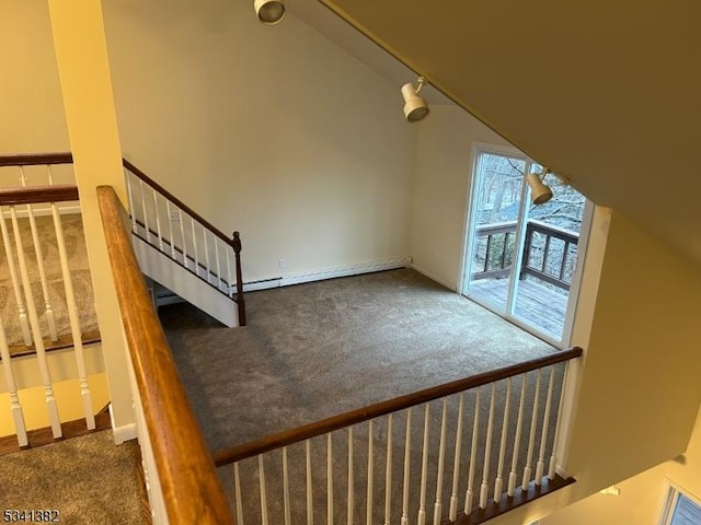 bonus room with lofted ceiling, stairway, and carpet