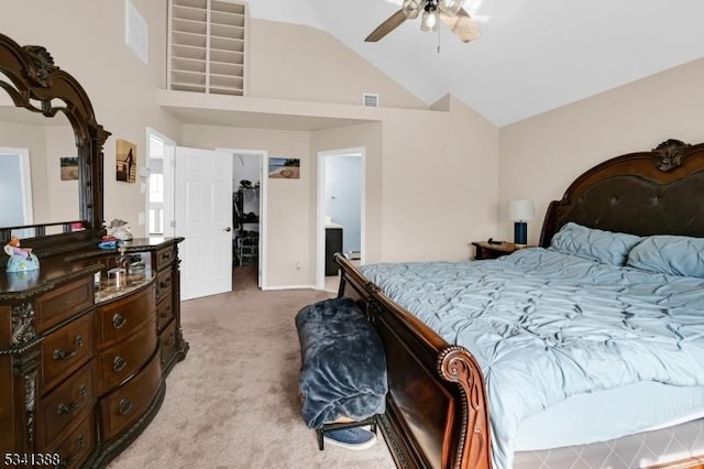 bedroom with visible vents, a spacious closet, light carpet, ceiling fan, and high vaulted ceiling