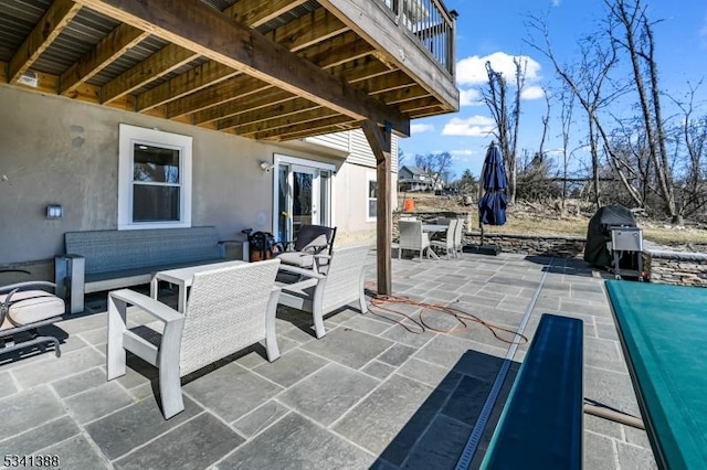 view of patio / terrace featuring an outdoor living space, outdoor dining area, and grilling area