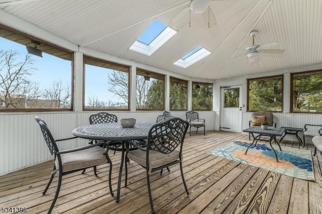 sunroom / solarium featuring a ceiling fan and lofted ceiling