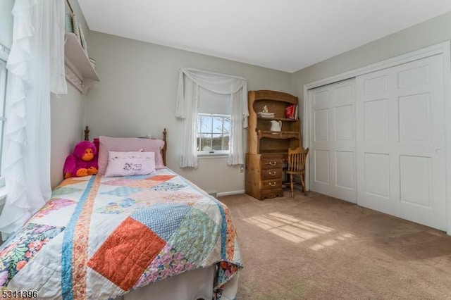 bedroom with a closet and carpet flooring