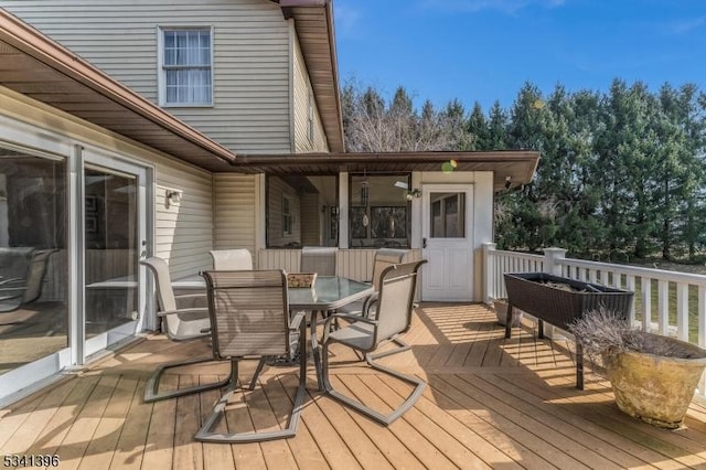 deck with outdoor dining space