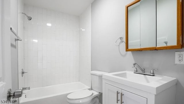 full bath with washtub / shower combination, vanity, and toilet