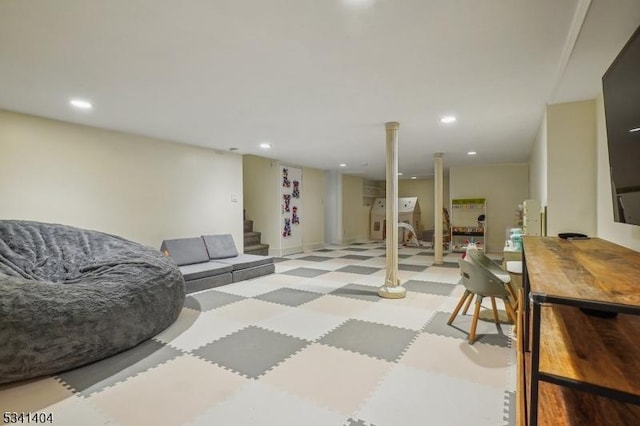 living area featuring recessed lighting and stairs