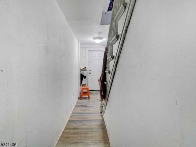 corridor featuring light wood-style flooring