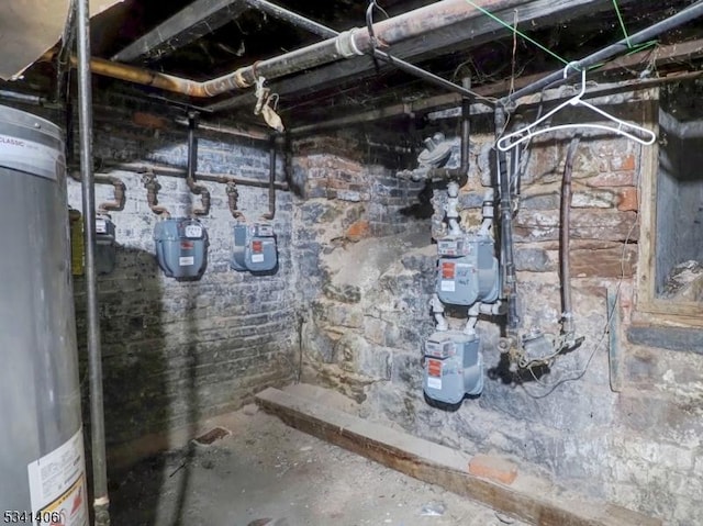 unfinished below grade area featuring water heater