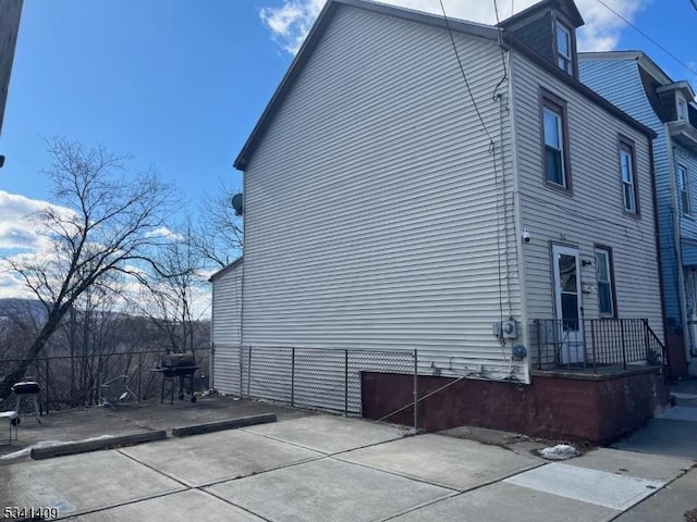 view of property exterior with fence