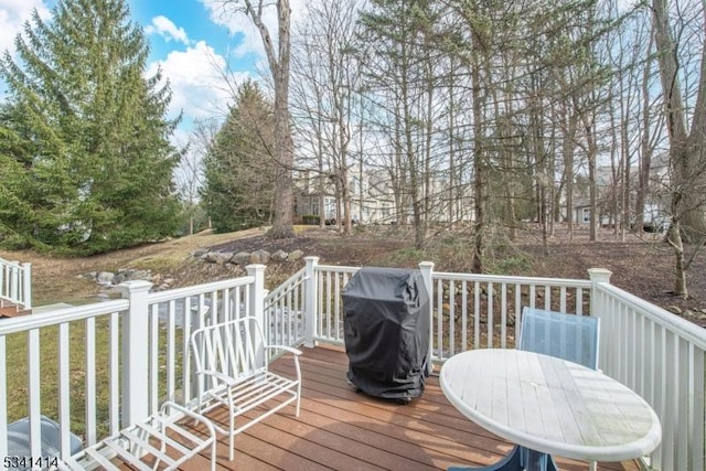 wooden deck featuring grilling area