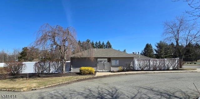 ranch-style house with fence