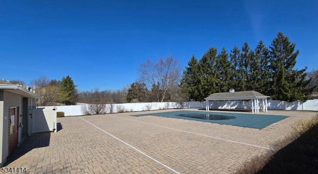 view of swimming pool featuring a gazebo, a fenced in pool, a patio, and a fenced backyard