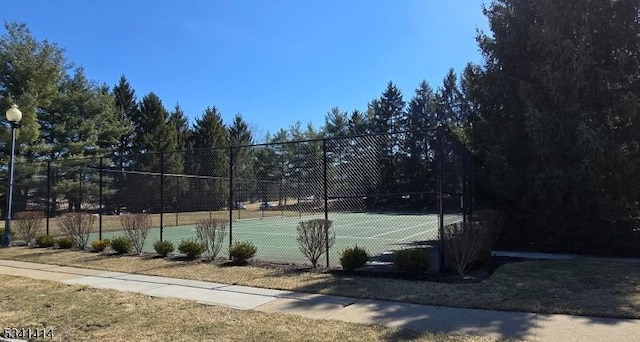 view of sport court with fence