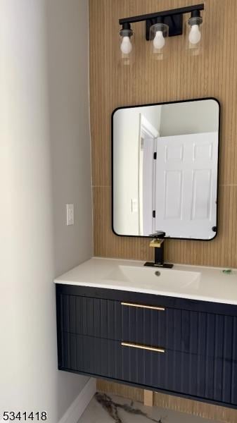 bathroom featuring vanity and baseboards