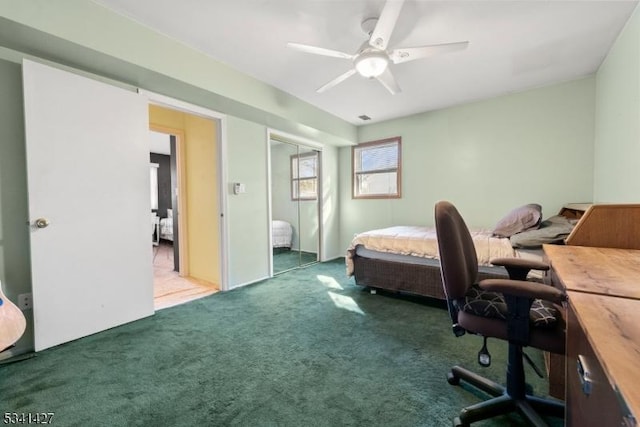 carpeted bedroom with visible vents, a ceiling fan, and a closet