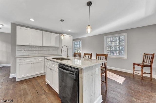 kitchen with dishwasher, dark wood-style floors, a sink, and decorative backsplash