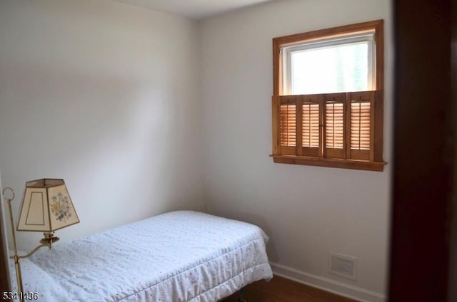 bedroom with visible vents and baseboards