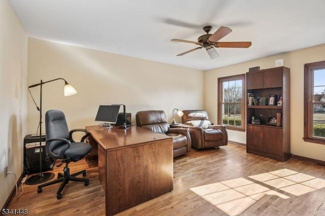 home office with ceiling fan, baseboards, and wood finished floors