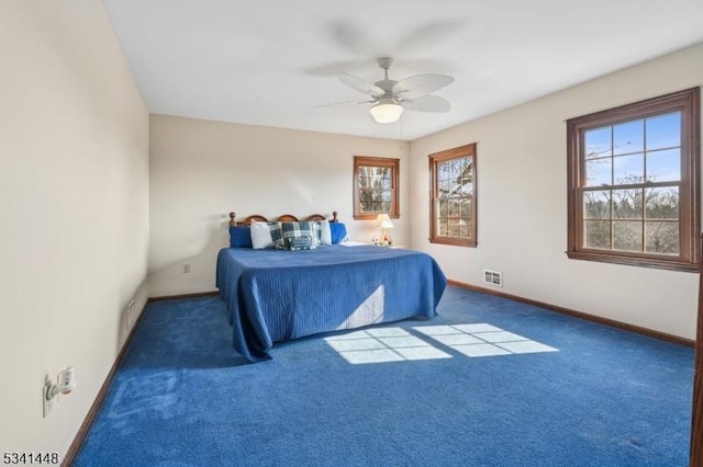 bedroom featuring carpet, visible vents, ceiling fan, and baseboards