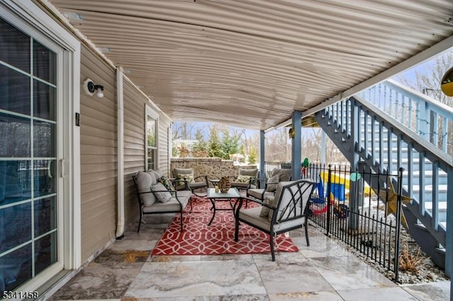 view of patio / terrace featuring fence and an outdoor living space