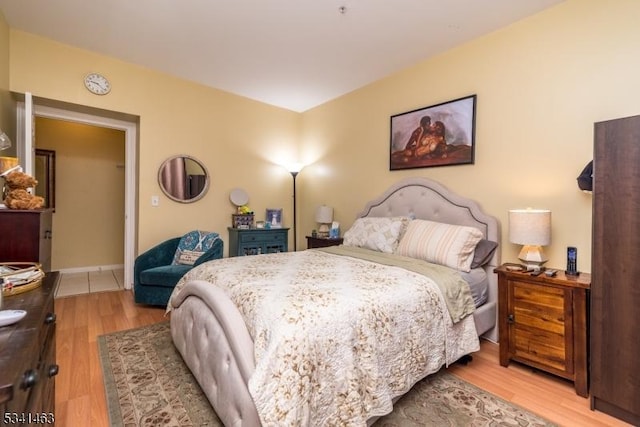 bedroom featuring wood finished floors