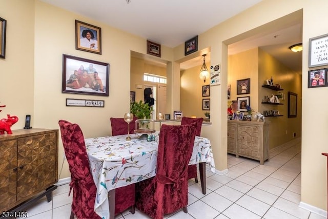 tiled dining area with baseboards