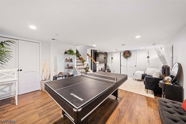 game room with wood finished floors and recessed lighting