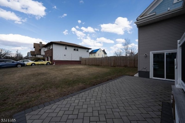 view of patio / terrace featuring fence